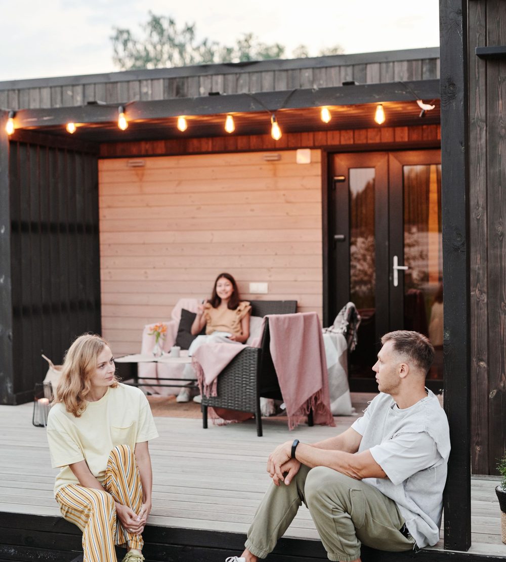 Family relaxing together on a pest-free backyard patio